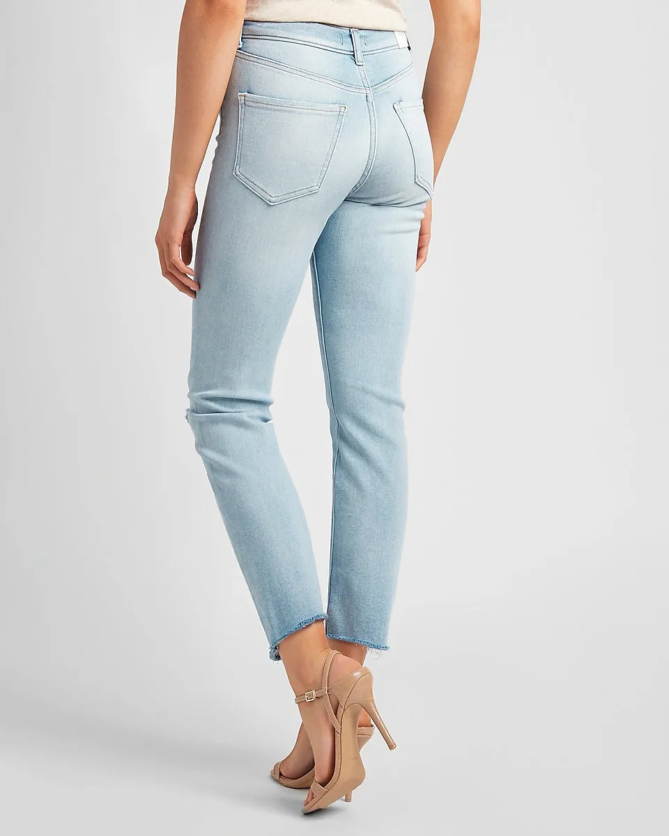 High Waisted Ripped Raw Hem Slim Jeans in Light Wash