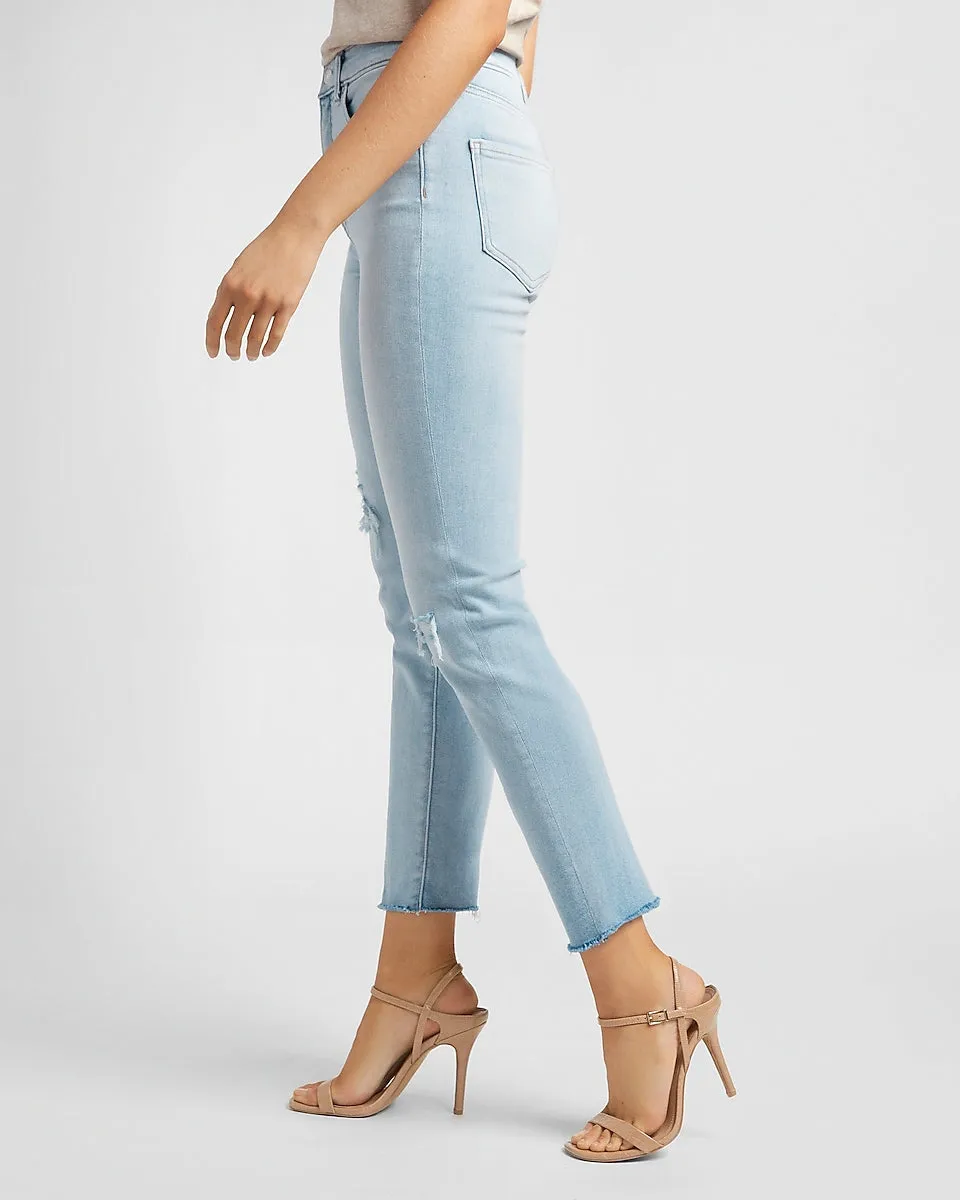 High Waisted Ripped Raw Hem Slim Jeans in Light Wash