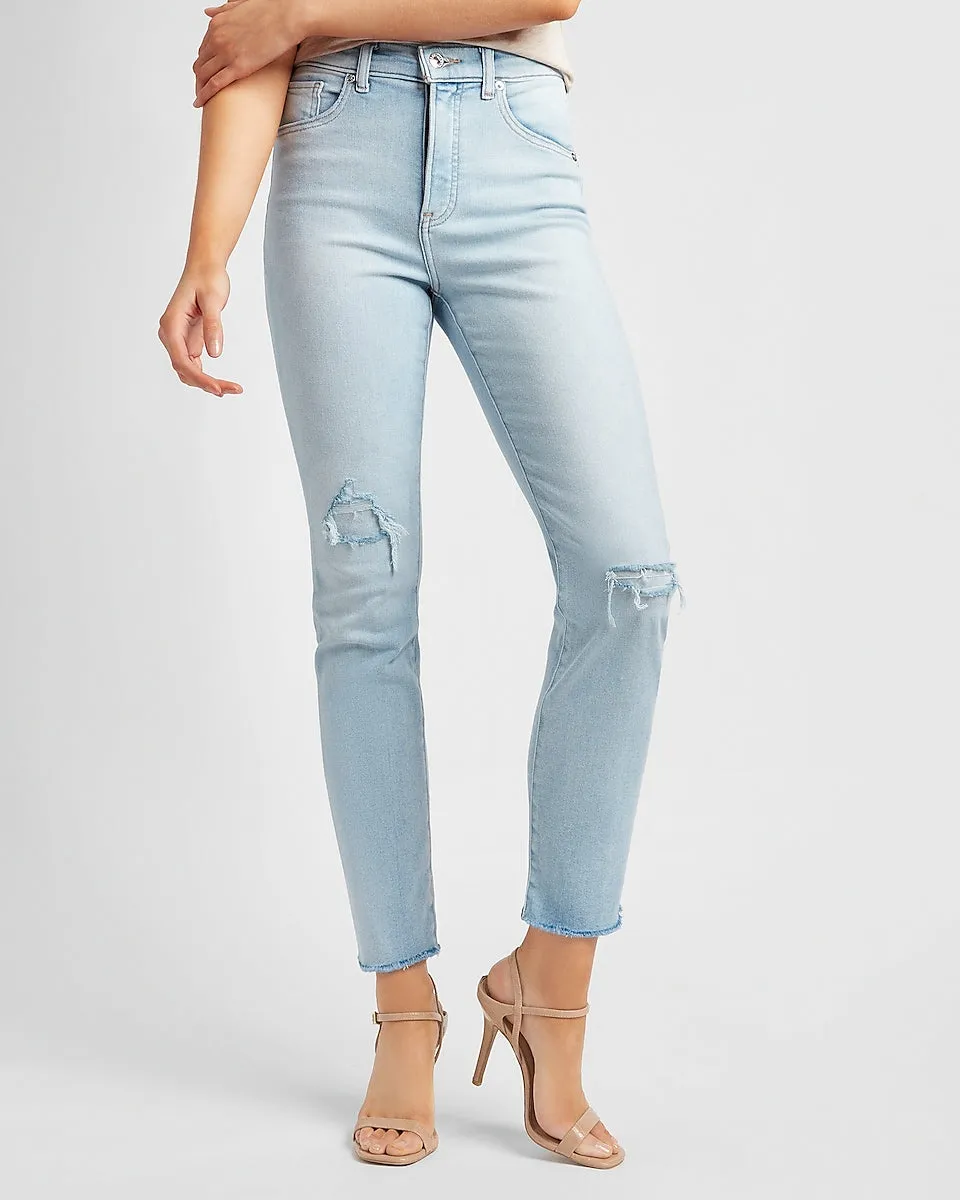 High Waisted Ripped Raw Hem Slim Jeans in Light Wash